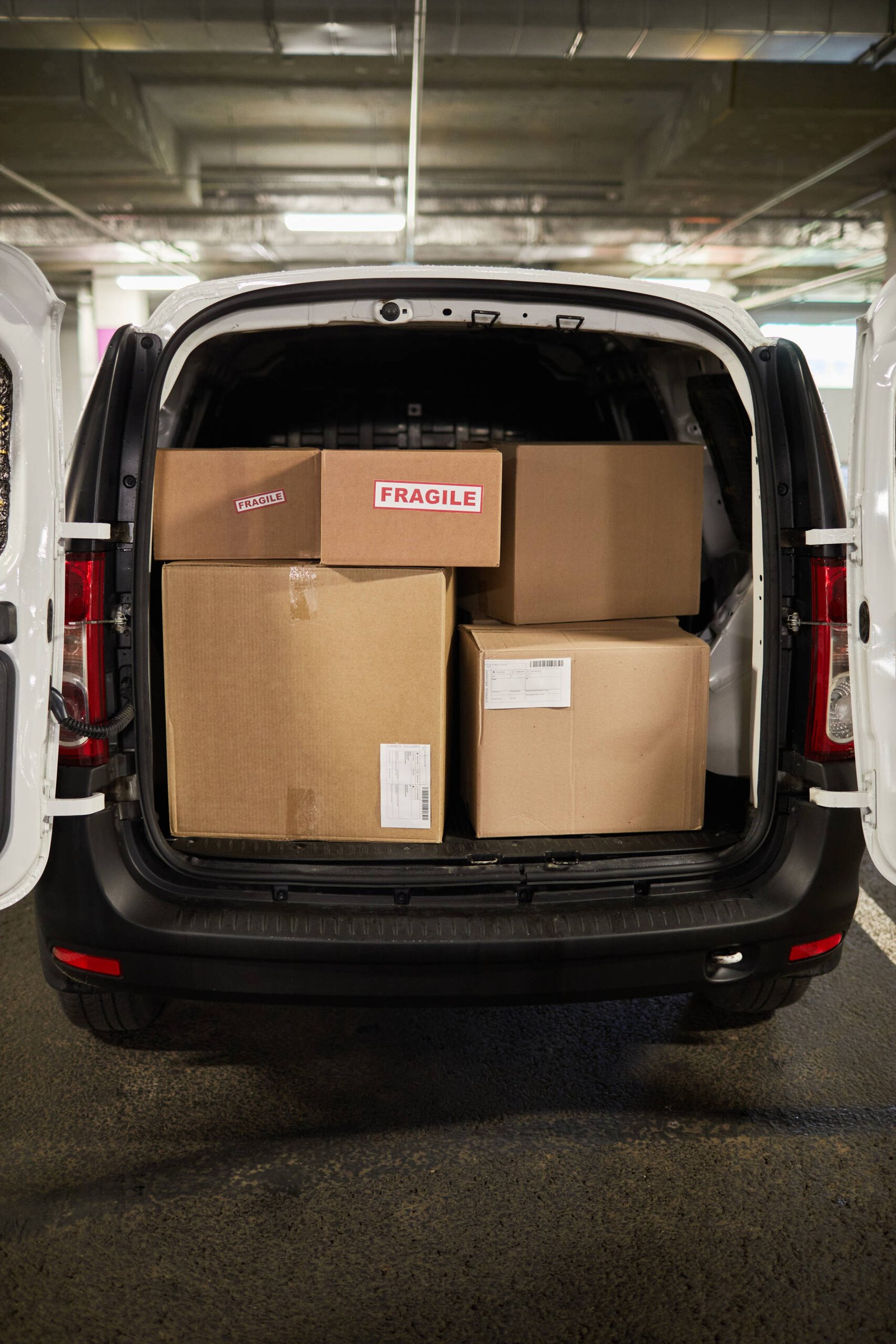 Vertical background image of delivery van or moving van filled with boxes, copy space